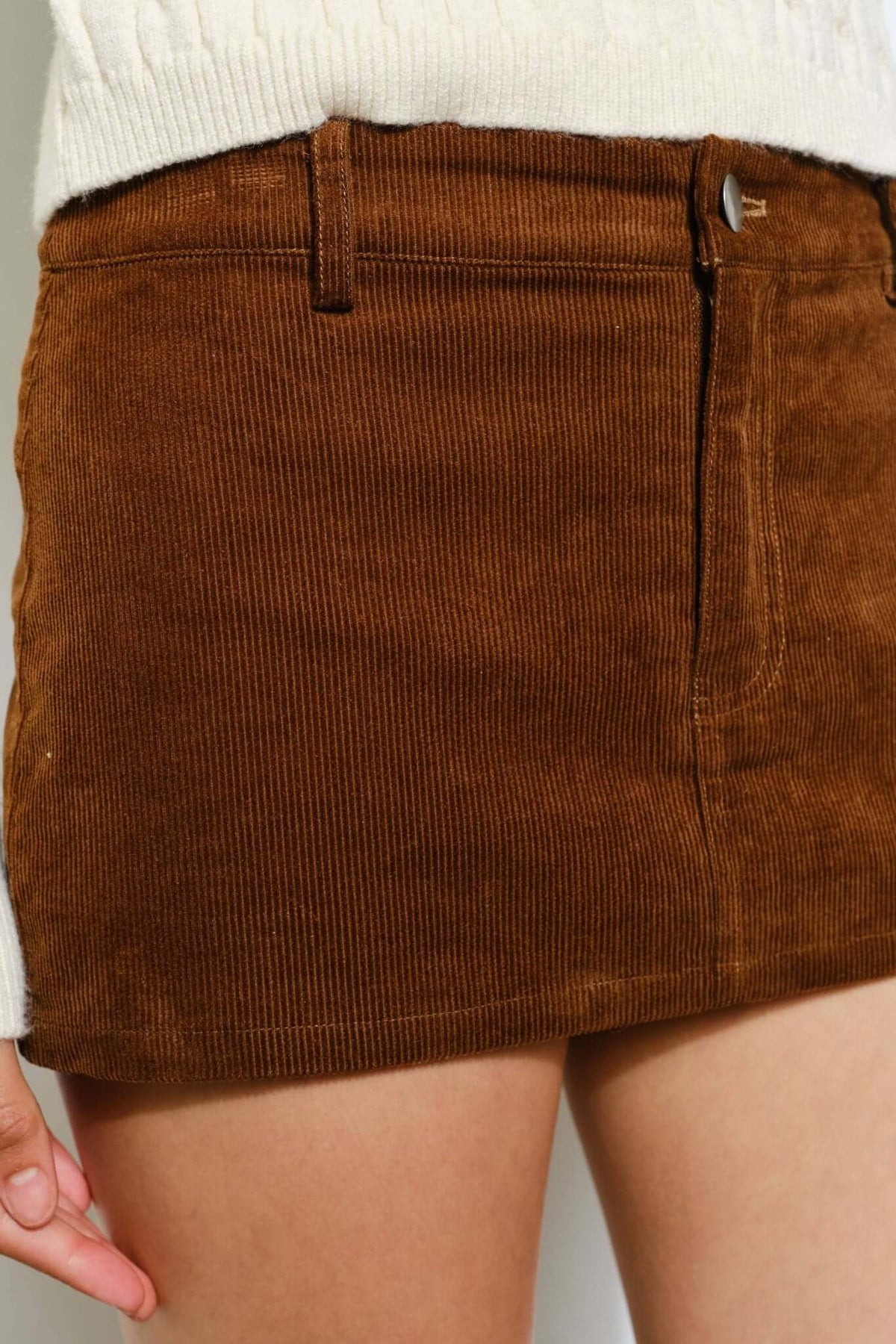 Pretty Garbage Peyton corduroy skort, casual retro bottom with a trendy design, shown in a relaxed style.