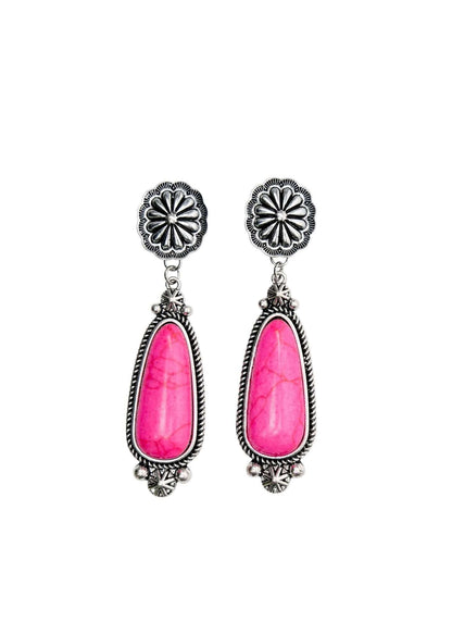 Pink statement earring on silver concho post by West & Co., featuring bold pink color and unique concho design.