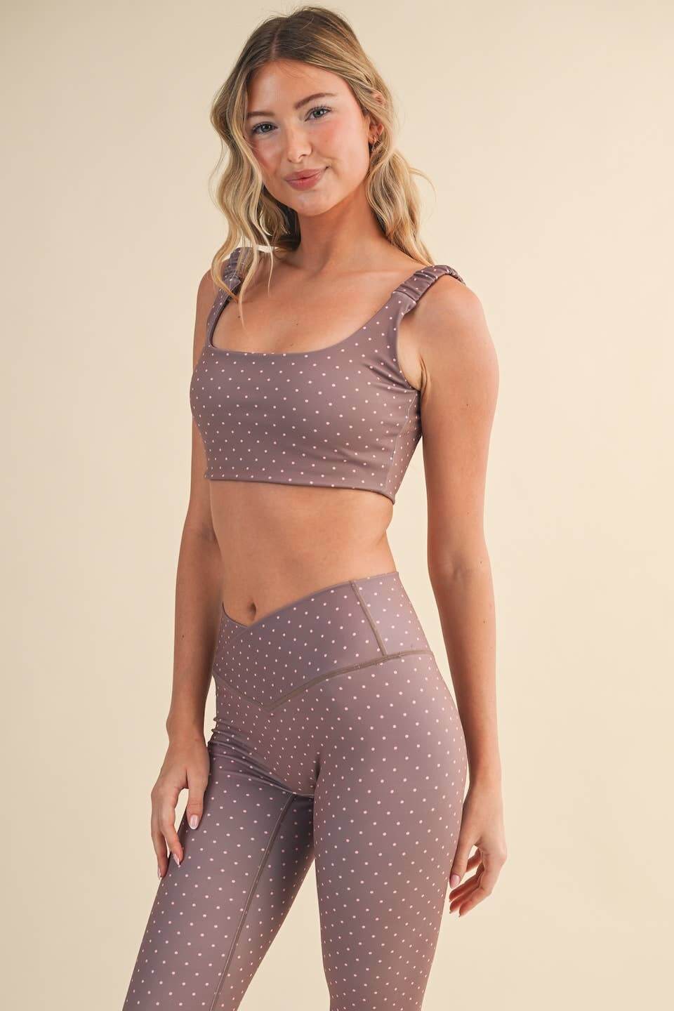 Polka dot print ruched bra top from Kimberly C, stylish sleeveless blouse with gathered detailing and a playful pattern.