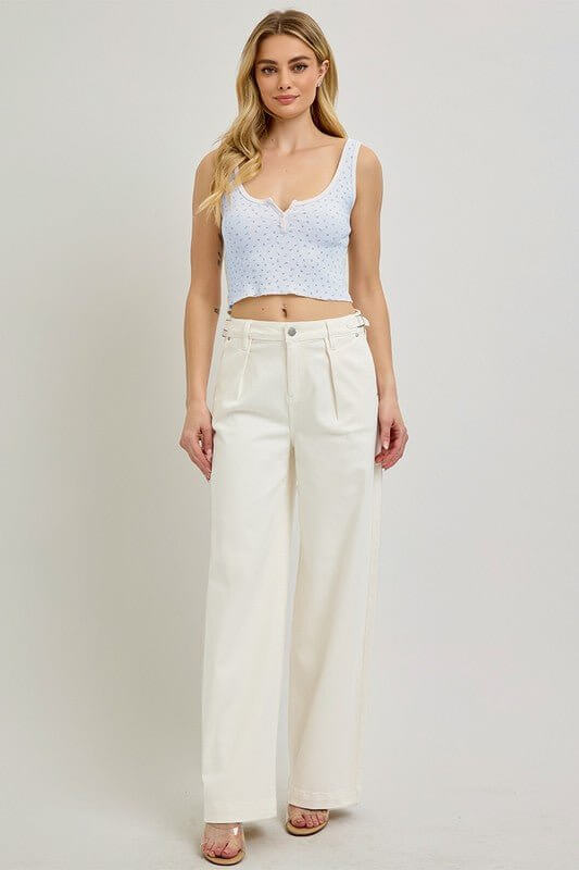 Risen adjustable waistband slouch wide pleated pants showing relaxed fit, wide leg design, and pleats in soft fabric.