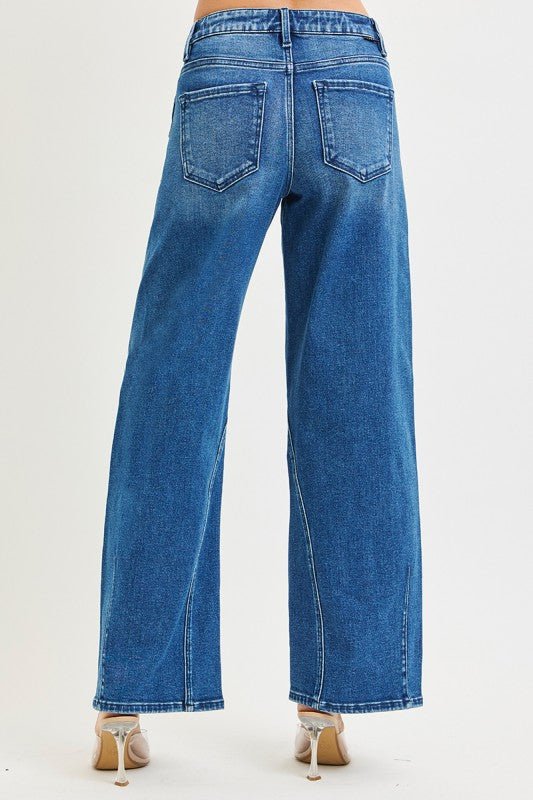 Risen Slouchy Barrel Jeans showing relaxed fit, light wash denim, and distressed details on the casual bottoms.