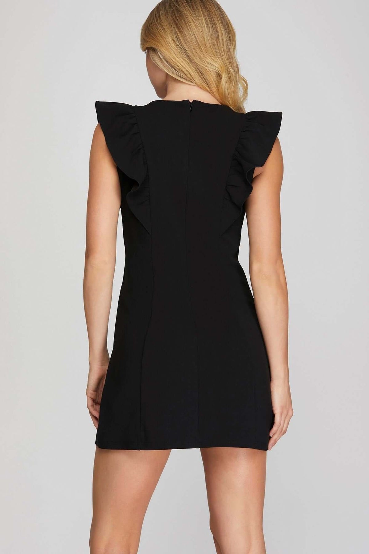 She and Sky ruffle sleeve heavy knit mini dress showcasing bold, sleek, and feminine style with textured fabric and fashionable design.