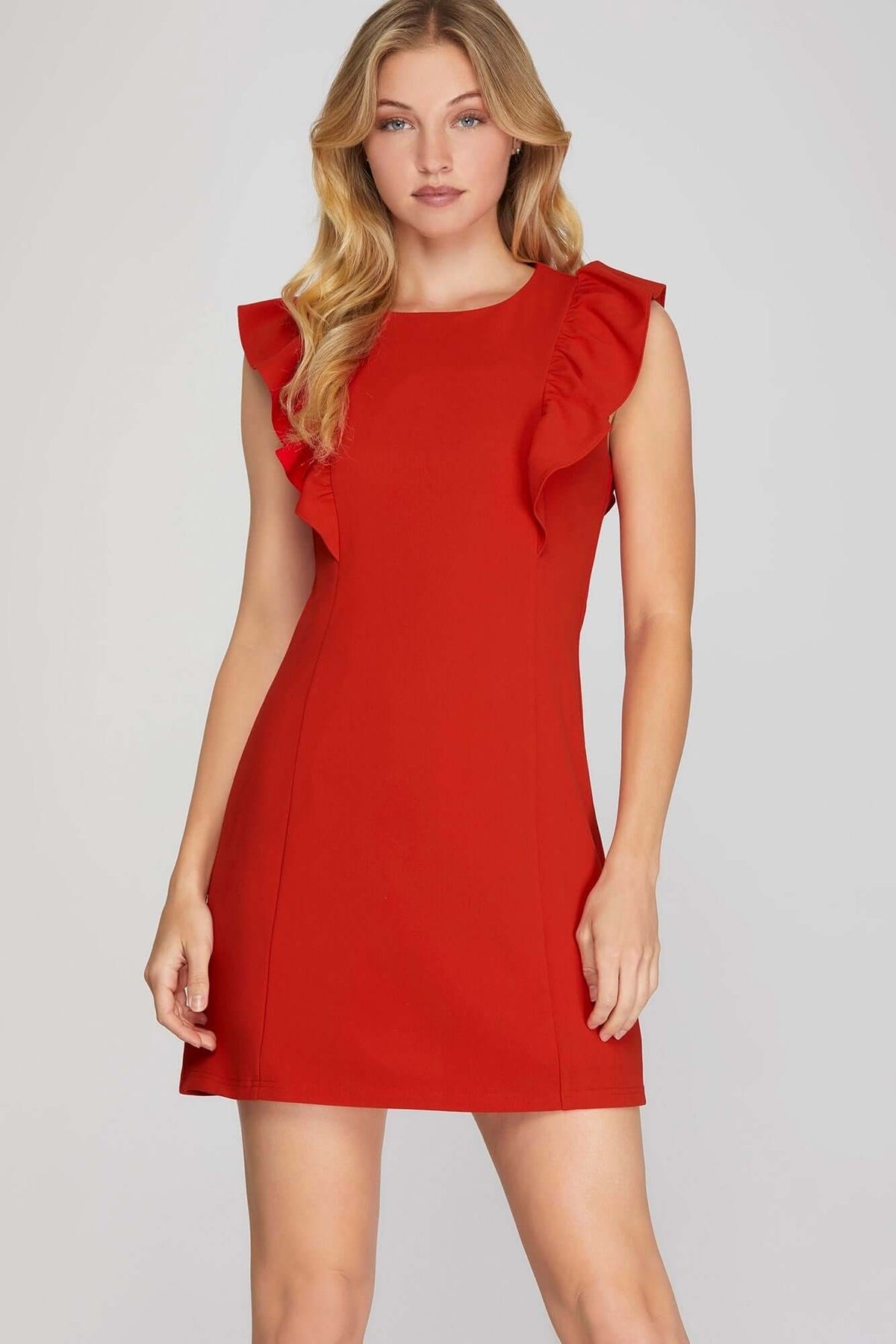 She and Sky ruffle sleeve heavy knit mini dress showcasing bold, sleek, and feminine style with textured knit fabric.