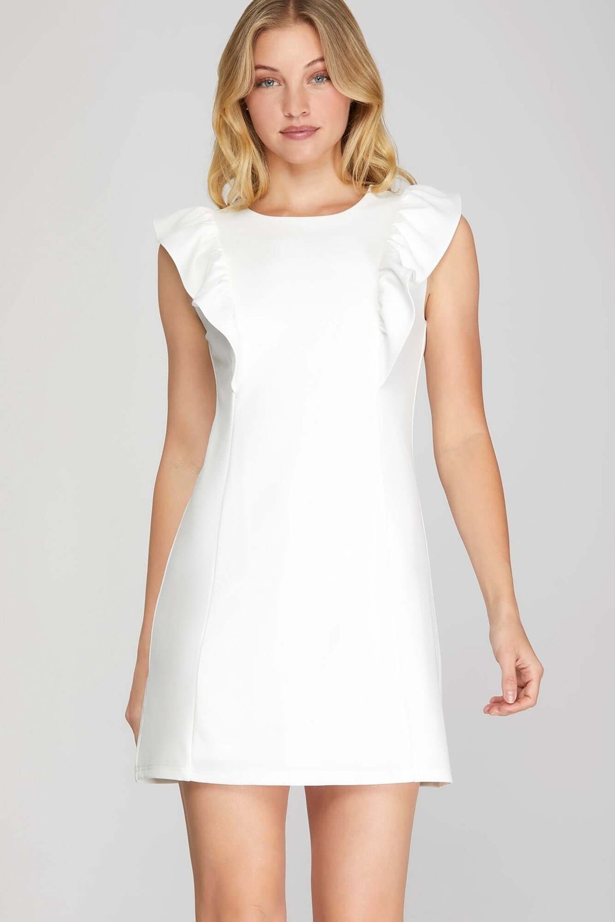 She and Sky ruffle sleeve heavy knit mini dress showcasing a sleek, feminine silhouette with bold design details.