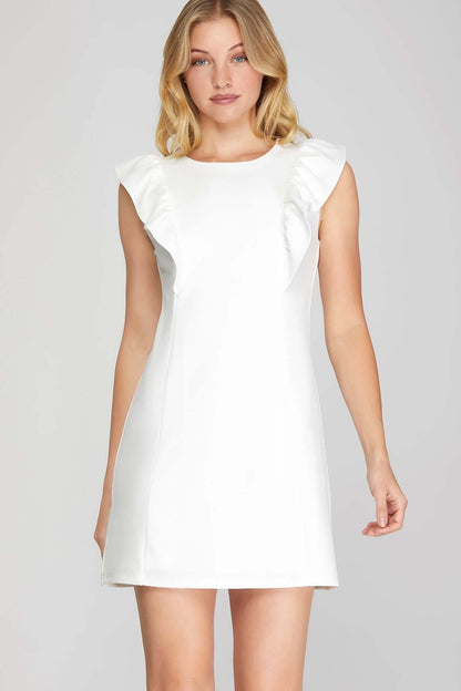 She and Sky ruffle sleeve heavy knit mini dress showcasing a sleek, feminine silhouette with bold design details.