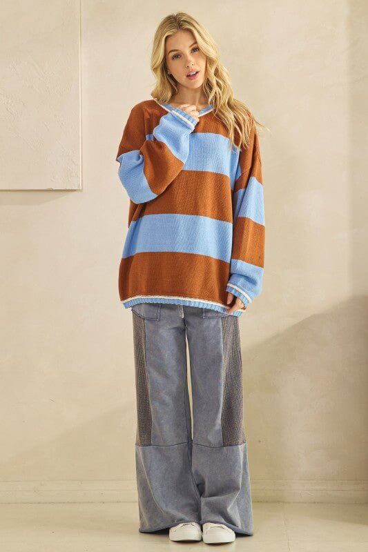 Rust and sky blue oversized striped knit sweater by Sage + Fig, featuring a cozy, chunky knit design and relaxed fit.