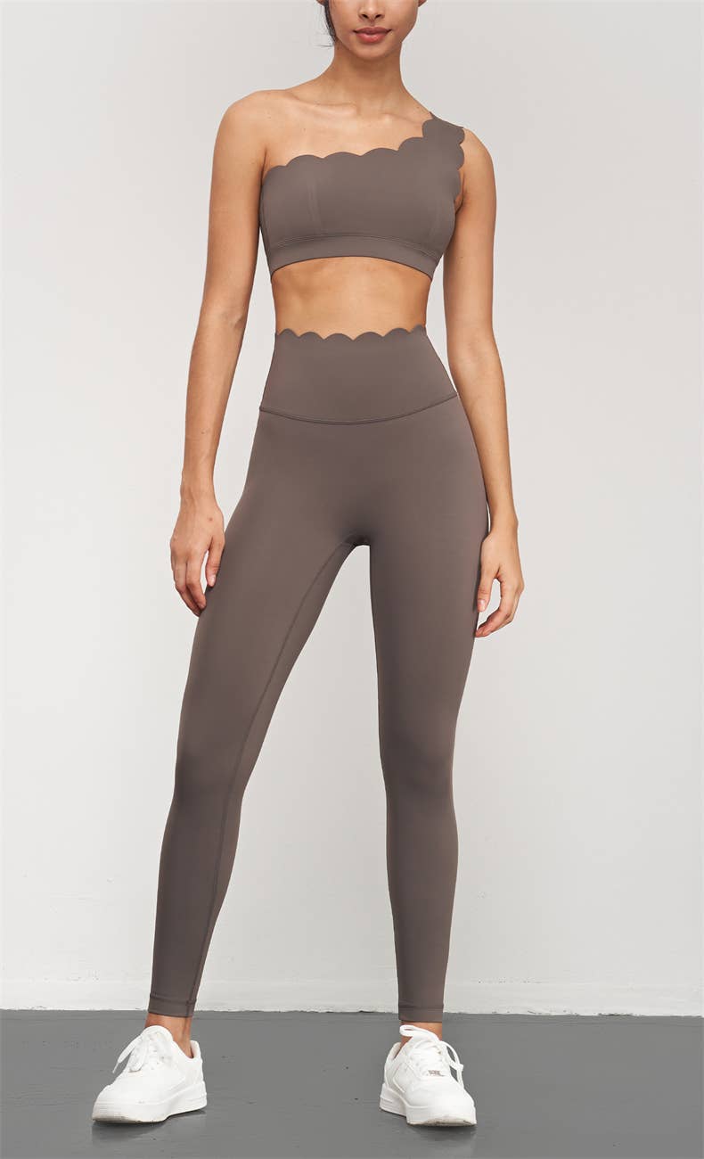 High waist scallop top activewear leggings by 91thelabel, showcasing a close-up of the scalloped waistband and stretchy fabric.