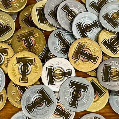 Shotgun shell T lapel pin by Brand Dandee, a small metal accessory with a realistic shotgun shell design for clothing or accessories.