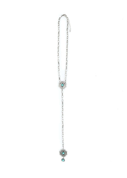 Silver chain lariat necklace with Aztec concho detail from West & Co. showcasing intricate silver jewelry design.