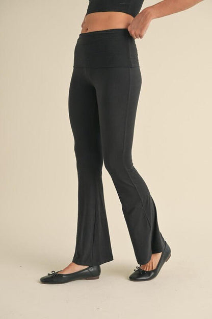 Soft knit flare leggings from KIMBERLY C, showcasing their comfortable fit and stylish flare design for active wear.