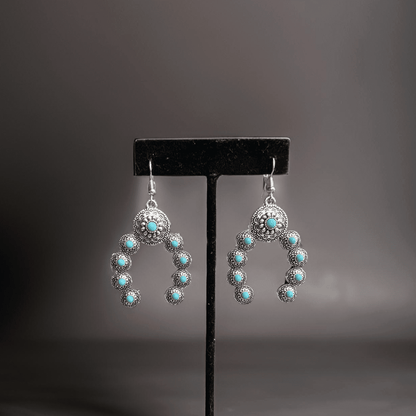 Squash Blossom Naja Western faux turquoise earrings by Westrian International, featuring traditional southwestern jewelry design