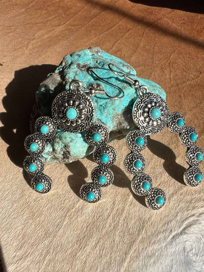 Western faux turquoise squash blossom naja earrings by Westrian International, featuring intricate silver-tone jewelry design.