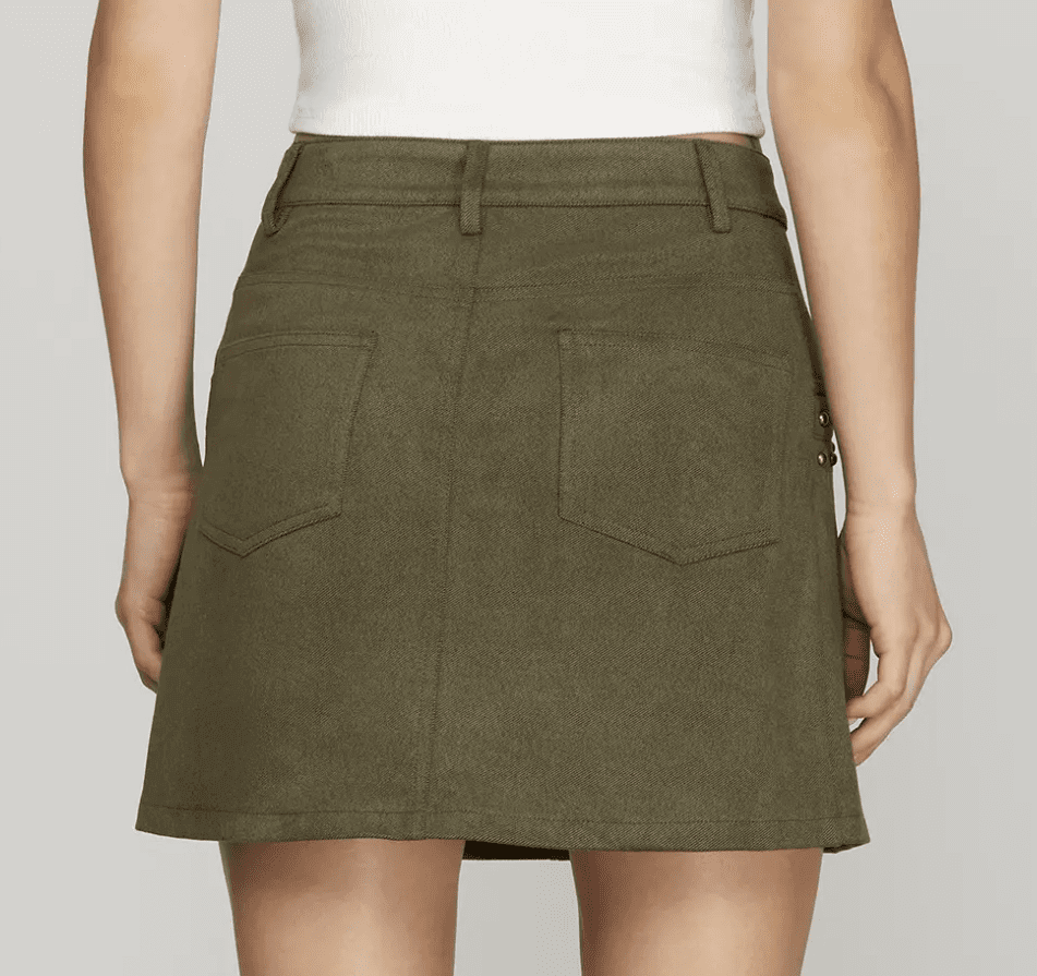 Black studded mini skirt from She and Sky featuring metal stud embellishments, designed as a stylish bottom for edgy fashion.