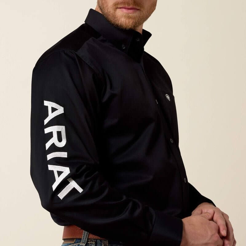 Ariat team logo twill classic fit shirt featuring a chest logo, button-up design, and long sleeves, displayed on a hanger.