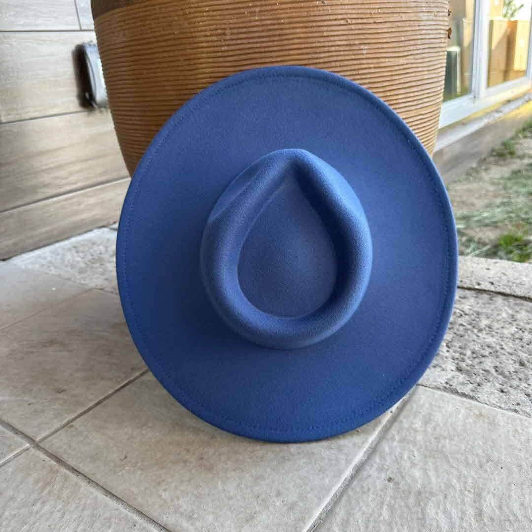 Vegan felt rancher hat from Queens INC in various colors, featuring a wide brim and classic cowboy style.