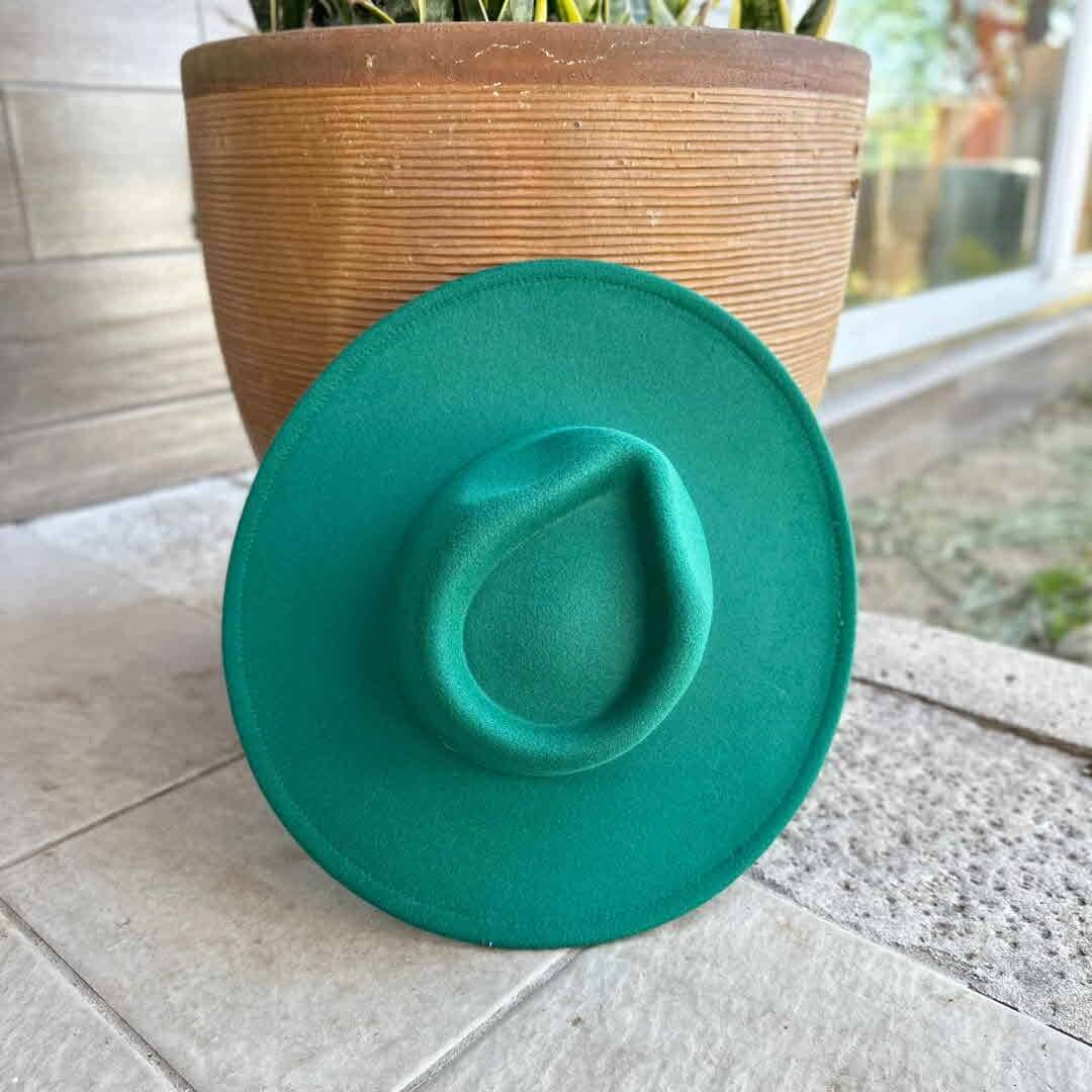 Vegan felt rancher hat by Queens INC in various colors, featuring a wide brim and classic cowboy style.