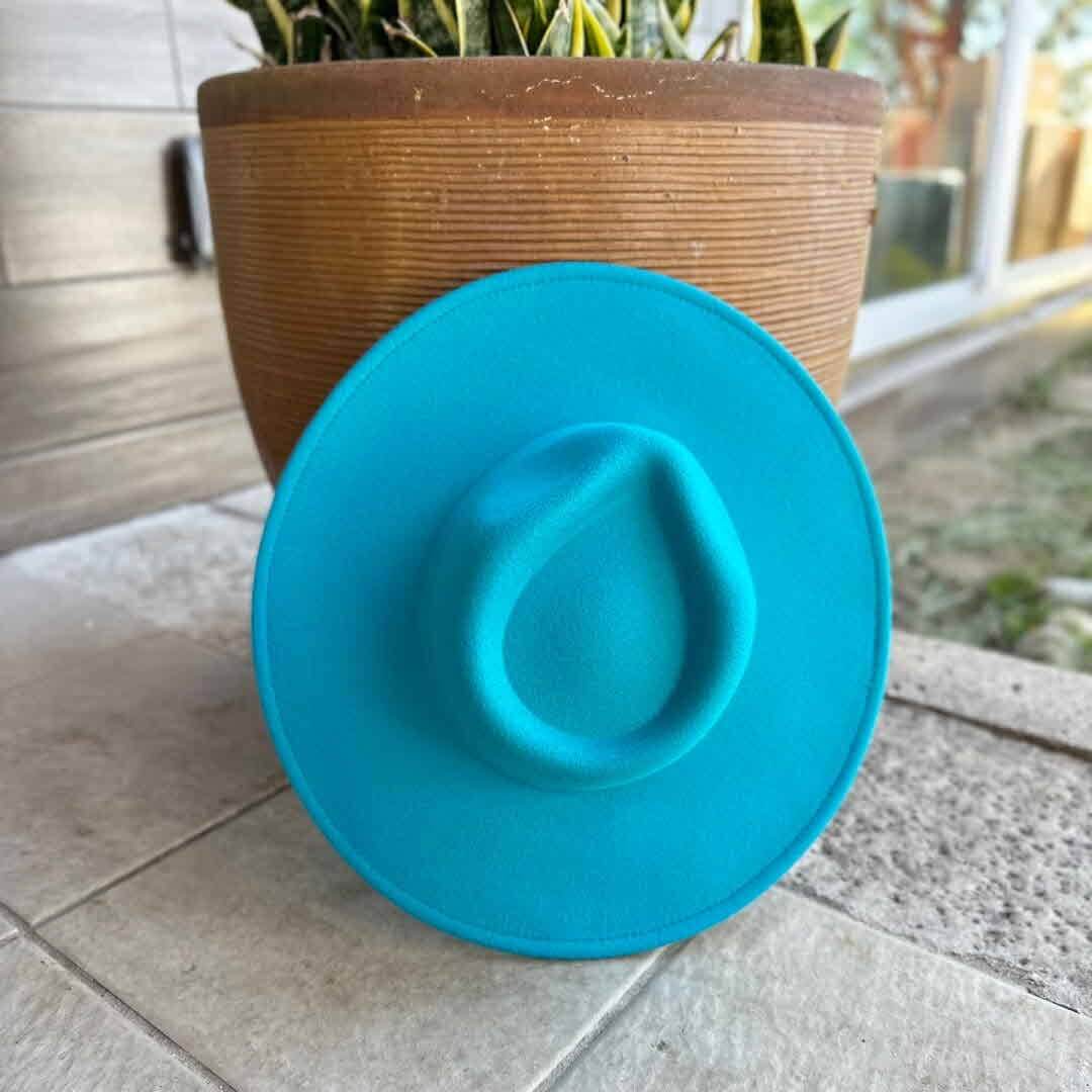 Vegan felt rancher hat by Queens INC in multiple colors, showcasing a wide-brimmed, stylish accessory for outdoor or casual wear.
