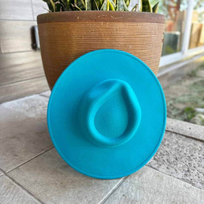 Vegan felt rancher hat by Queens INC in multiple colors, showcasing a wide-brimmed, stylish accessory for outdoor or casual wear.