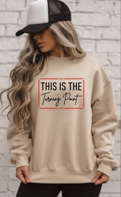 Ocean and 7th "This Is The Turning Point" graphic sweatshirt with bold design and comfortable fit, shown on a model.