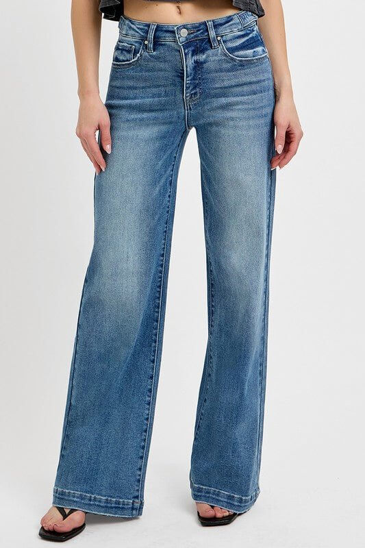 Risen high-rise wide-leg jeans with tummy control and adjustable waistband, made of denim fabric, in a relaxed fit style.