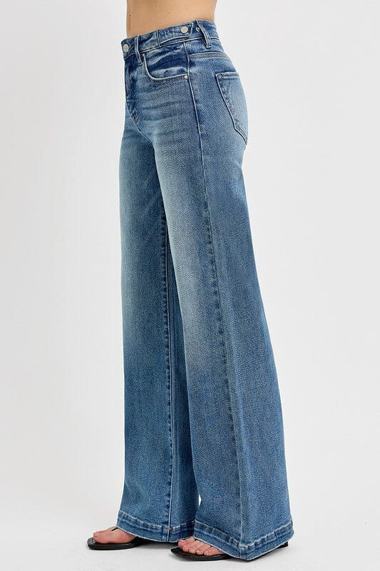 Risen high-rise wide-leg jeans with tummy control and adjustable waistband, shown on a model, in a denim finish.