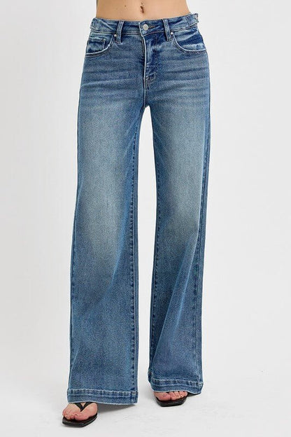 Risen high-rise wide-leg jeans with tummy control and adjustable waistband, made from durable denim fabric.