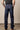Kimes Ranch Watson men's dark wash relaxed bootcut denim jeans displayed on a hanger, showing classic fit and dark wash color.