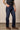Kimes Ranch Watson men's dark wash relaxed bootcut denim jeans laid flat showing back pockets and classic fit style.
