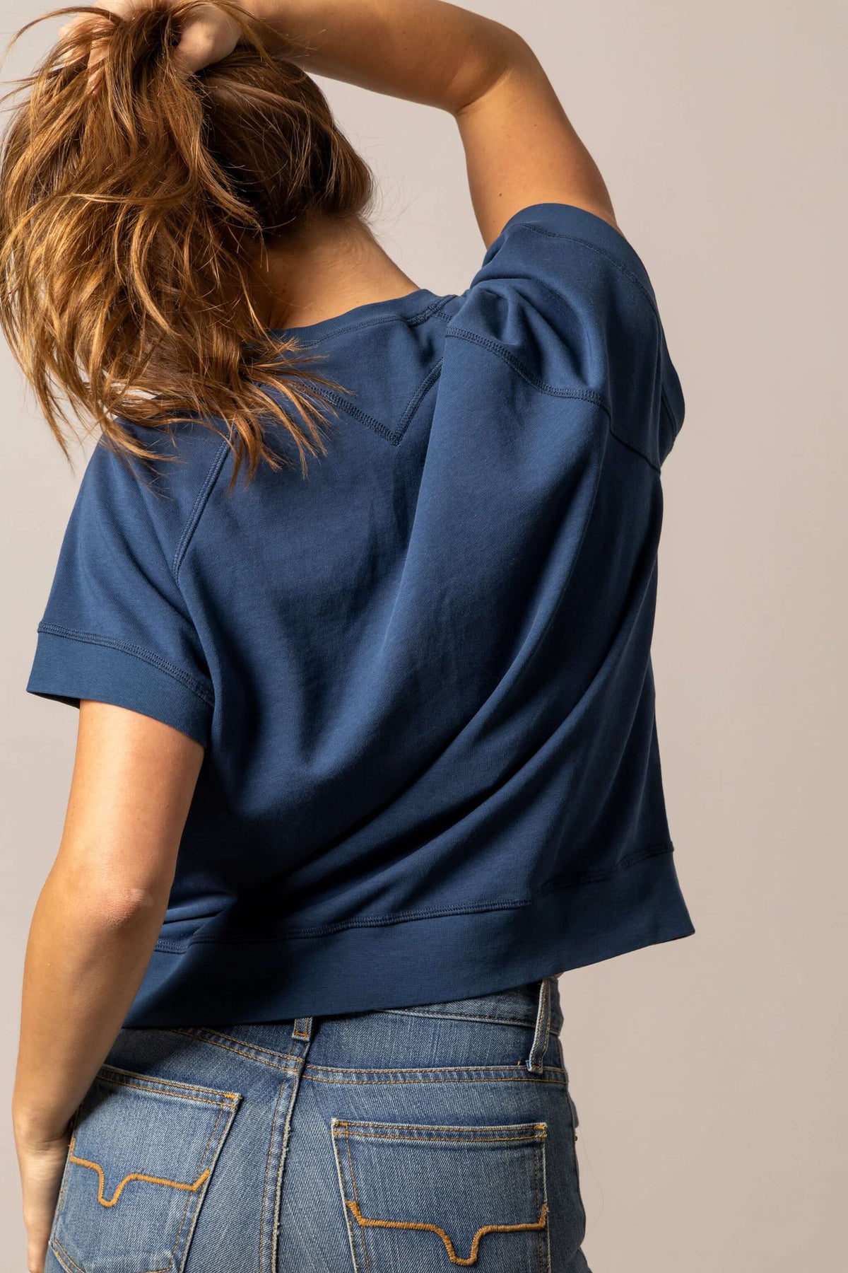 Kimes Ranch women's navy cropped short sleeve sweatshirt with graphic design, casual and stylish for comfortable wear.
