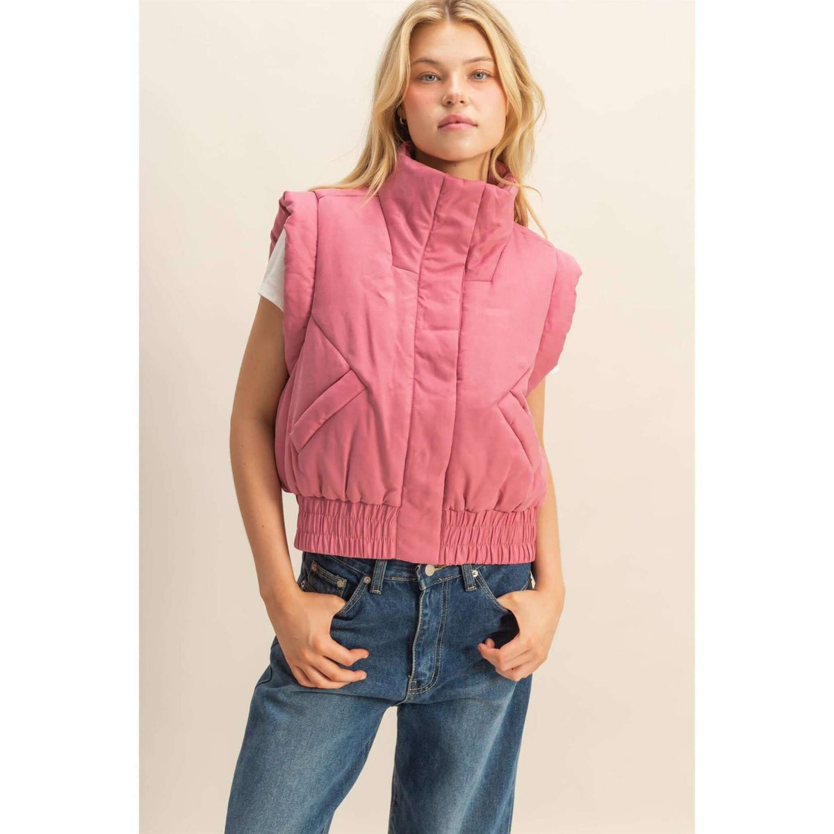 HYFVE versatile puffer vest shown on a hanger, lightweight outerwear with quilted design and stand-up collar for casual wear.