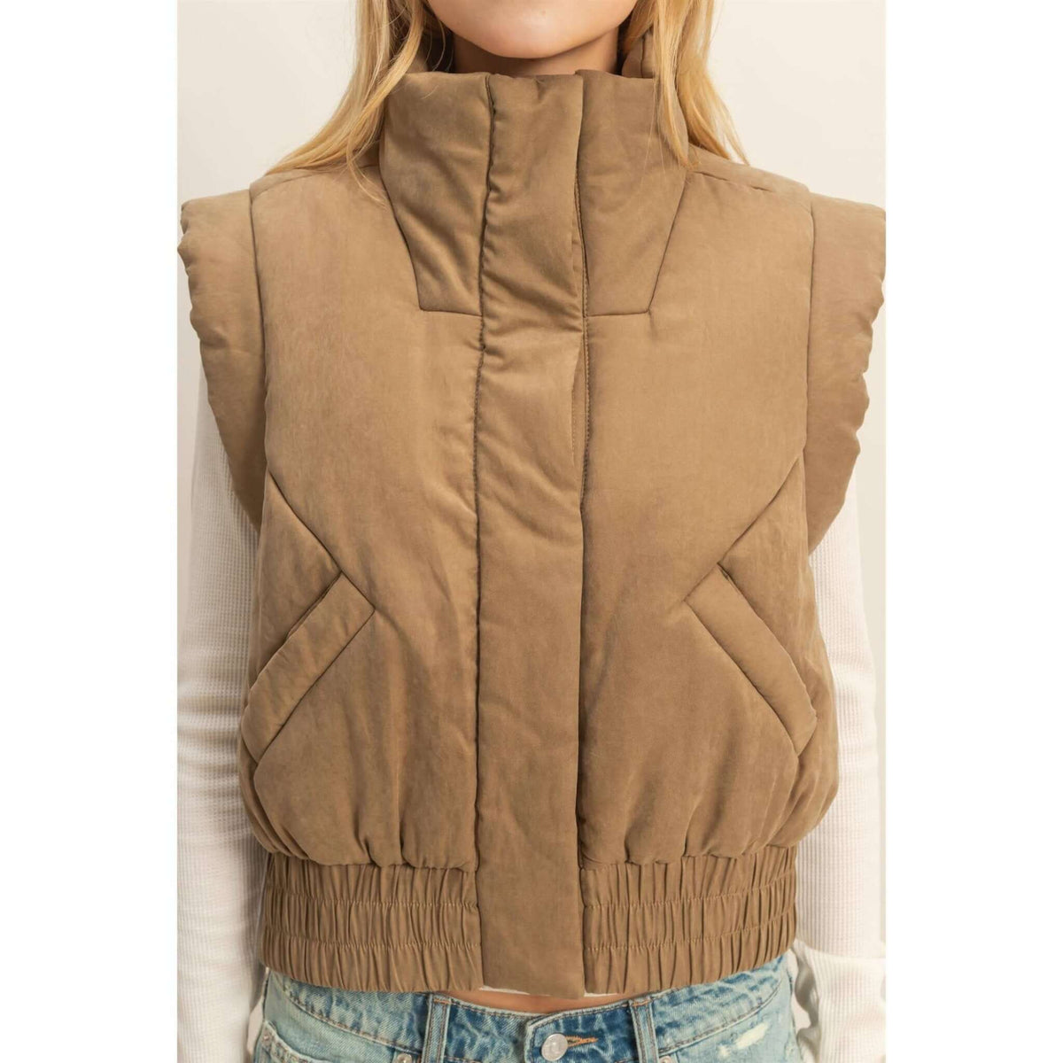 HYFVE versatile puffer vest in black, showcasing its quilted design and sleeveless style, ideal for layered outerwear.
