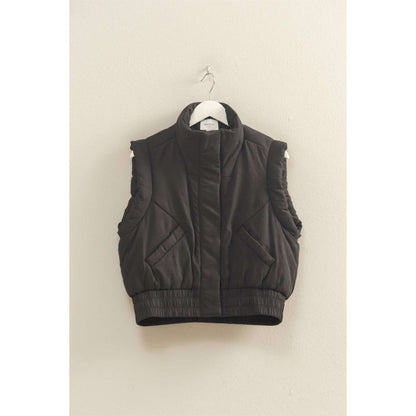 HYFVE versatile puffer vest in black, lightweight outerwear with a quilted design and zip closure, ideal for layering.