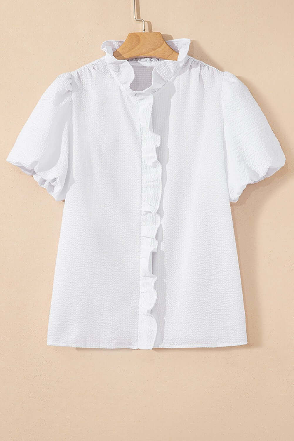 White ruffle-front puff sleeve blouse by Cowgirl Charm, stylish top with feminine ruffles and puffed sleeves.