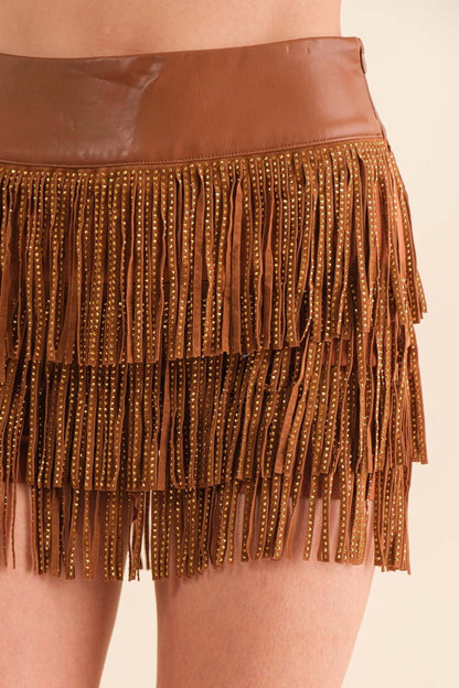 Blue B wide faux leather waist shorts with tiered fringe and studded details, stylish bottoms for a trendy look.