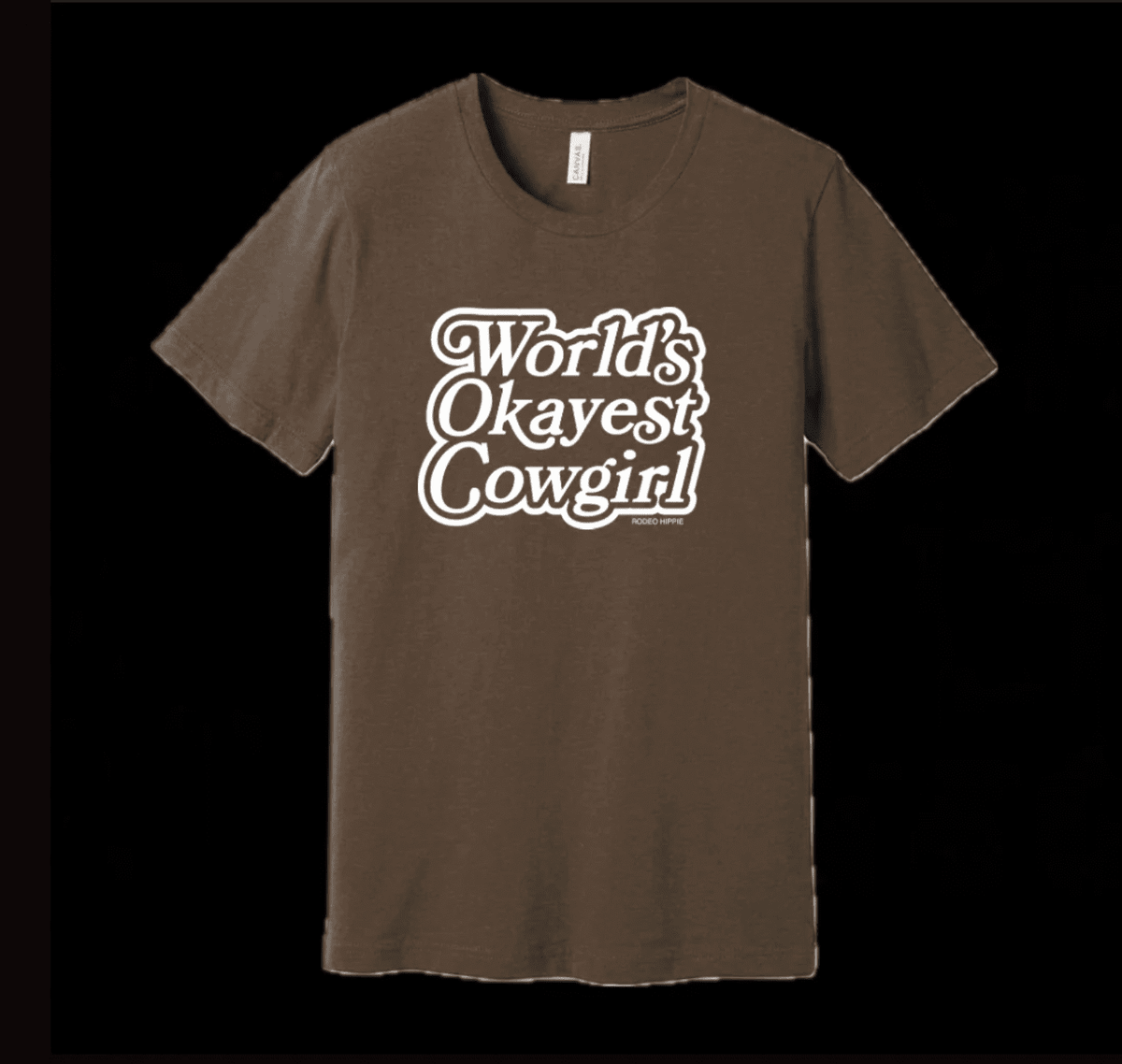 Gray graphic T-shirt featuring the "Worlds Okayest Cowgirl" design from Rodeo Hippie, casual Western-style tee for women.