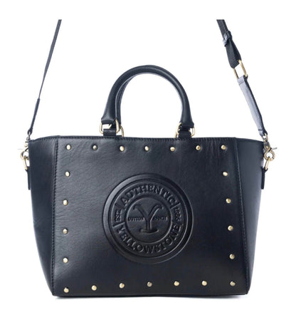 Cowgirl Charm Yellowstone Legancy studded leather tote bag with metal accents and sturdy handles, stylish and spacious for everyday use.